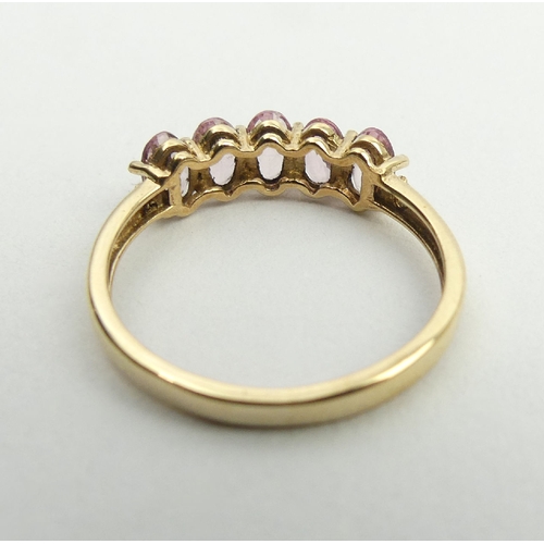 29 - 9ct gold pink tourmaline and diamond ring, 1.5 grams, 5.1mm, size N1/2. UK postage £12.