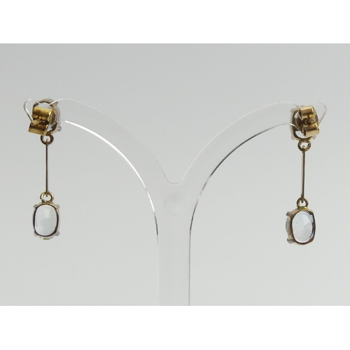 45 - A pair of 9ct gold blue topaz drop earrings, 2.5 grams, 26mm long.  UK Postage £12.