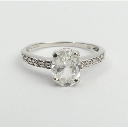 52 - 9ct white gold topaz and diamond ring, 1.9 grams, 8mm, size N1/2. UK Postage £12.