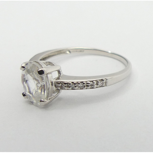 52 - 9ct white gold topaz and diamond ring, 1.9 grams, 8mm, size N1/2. UK Postage £12.