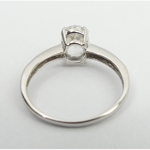 52 - 9ct white gold topaz and diamond ring, 1.9 grams, 8mm, size N1/2. UK Postage £12.