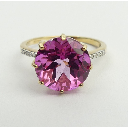 53 - 9ct gold pink sapphire and diamond ring, 2.9 grams, 11.9mm, size N1/2. UK Postage £12.