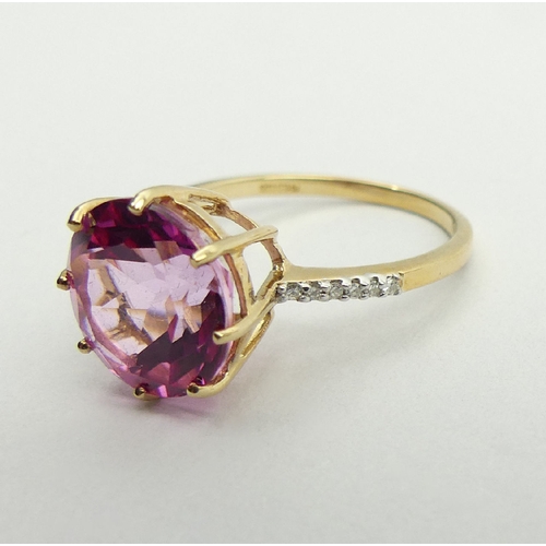 53 - 9ct gold pink sapphire and diamond ring, 2.9 grams, 11.9mm, size N1/2. UK Postage £12.