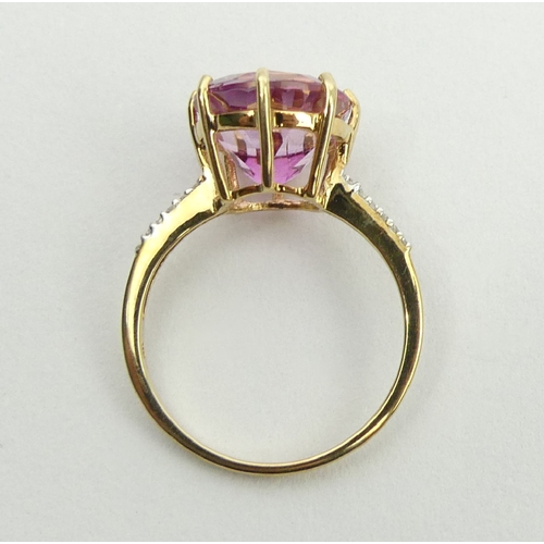 53 - 9ct gold pink sapphire and diamond ring, 2.9 grams, 11.9mm, size N1/2. UK Postage £12.