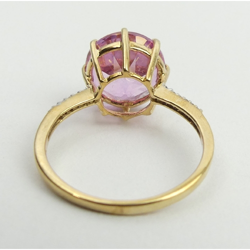 53 - 9ct gold pink sapphire and diamond ring, 2.9 grams, 11.9mm, size N1/2. UK Postage £12.