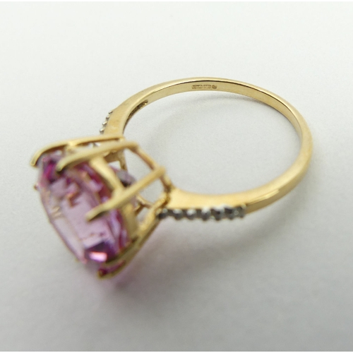 53 - 9ct gold pink sapphire and diamond ring, 2.9 grams, 11.9mm, size N1/2. UK Postage £12.