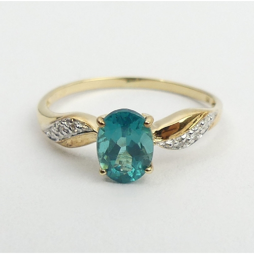 54 - 9ct gold blue stone and diamond ring, 1.2 grams, 6.9mm, size N1/2. UK Postage £12.