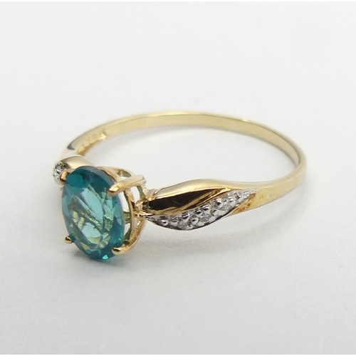 54 - 9ct gold blue stone and diamond ring, 1.2 grams, 6.9mm, size N1/2. UK Postage £12.