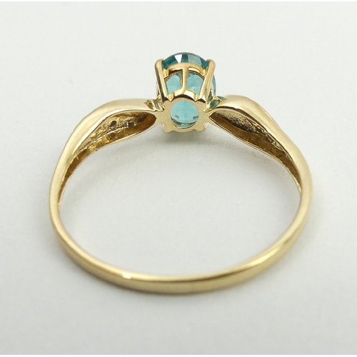 54 - 9ct gold blue stone and diamond ring, 1.2 grams, 6.9mm, size N1/2. UK Postage £12.