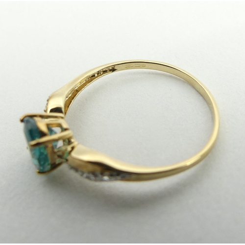 54 - 9ct gold blue stone and diamond ring, 1.2 grams, 6.9mm, size N1/2. UK Postage £12.