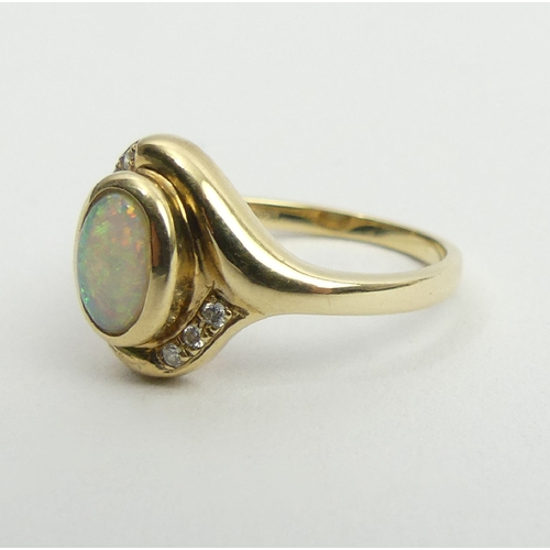 55 - 9ct gold opal and diamond ring, 2.6 grams, 12.3mm, size M1/2. UK Postage £12.