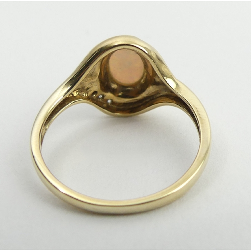 55 - 9ct gold opal and diamond ring, 2.6 grams, 12.3mm, size M1/2. UK Postage £12.