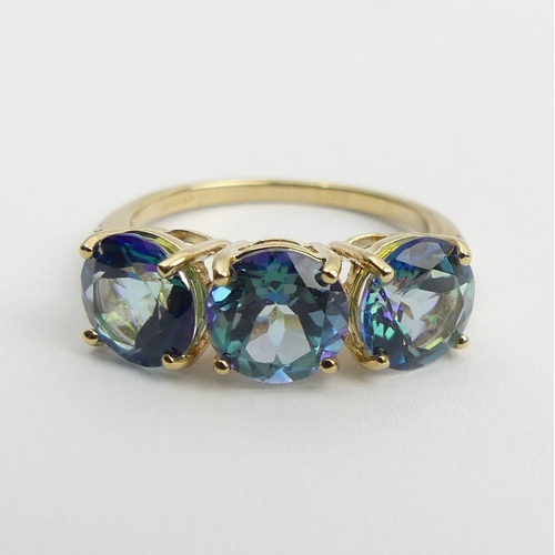 57 - 9ct gold mystic topaz and diamond ring, 3.2 grams, 7mm, size N. UK Postage £12.