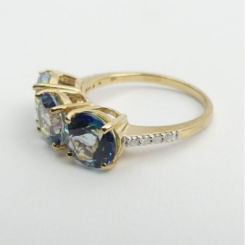 57 - 9ct gold mystic topaz and diamond ring, 3.2 grams, 7mm, size N. UK Postage £12.