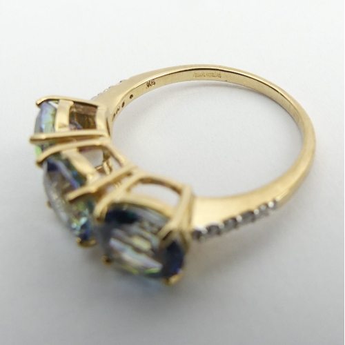 57 - 9ct gold mystic topaz and diamond ring, 3.2 grams, 7mm, size N. UK Postage £12.