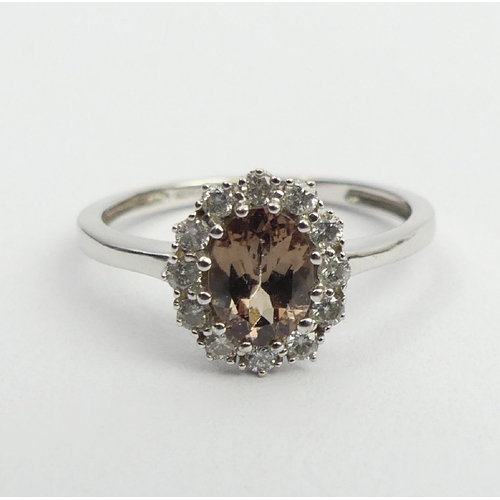 59 - 9ct white gold tourmaline and diamond ring, 2.1 grams, 10.2mm, size N1/2. UK Postage £12.