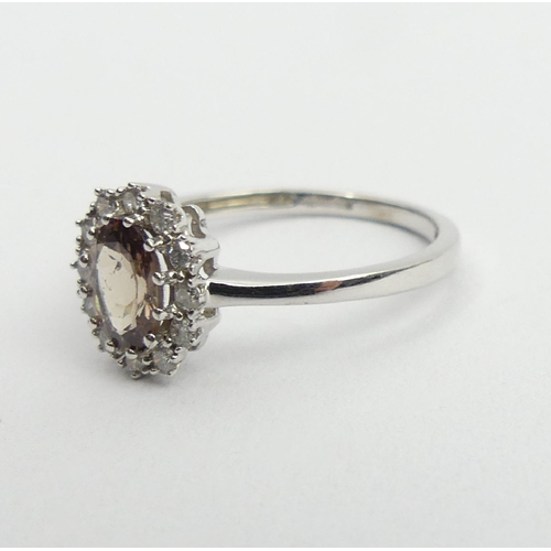 59 - 9ct white gold tourmaline and diamond ring, 2.1 grams, 10.2mm, size N1/2. UK Postage £12.