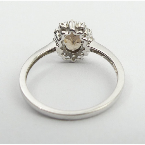 59 - 9ct white gold tourmaline and diamond ring, 2.1 grams, 10.2mm, size N1/2. UK Postage £12.