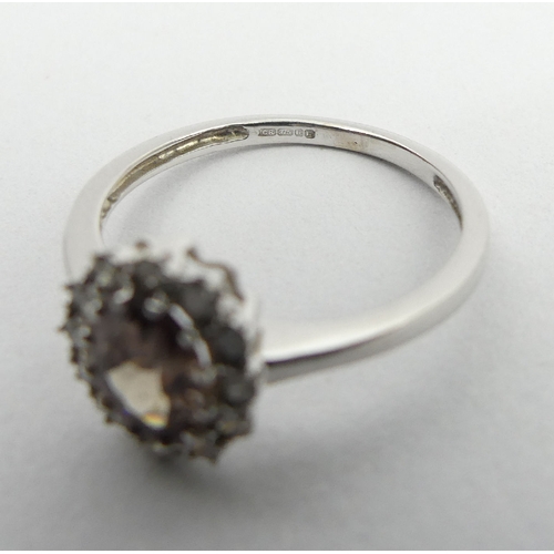 59 - 9ct white gold tourmaline and diamond ring, 2.1 grams, 10.2mm, size N1/2. UK Postage £12.