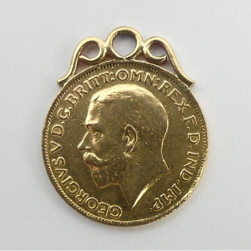 61 - George V 1918 gold full sovereign with 9ct mount. 8.7 grams. UK Postage £12.