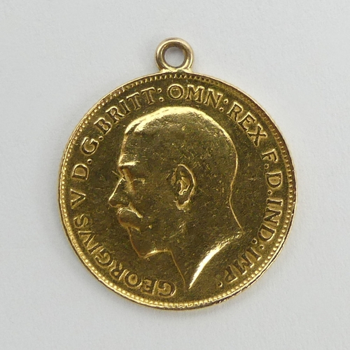 62 - George V 1926 half sovereign with a 9ct mount, 4 grams. UK Postage £12.