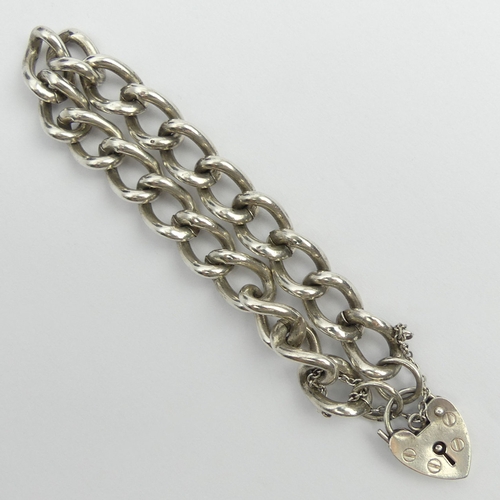 65 - Solid silver curb link gate bracelet, 31.1 grams, London 1990, 17cm x 10.5mm. UK Postage £12.