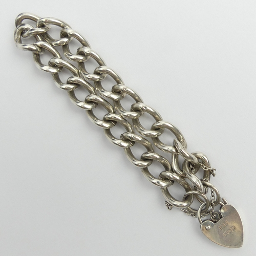 65 - Solid silver curb link gate bracelet, 31.1 grams, London 1990, 17cm x 10.5mm. UK Postage £12.