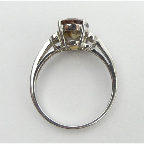 66 - 9ct white gold green citrine and diamond ring, 2.8 grams, 9mm, size N1/2. UK Postage £12.