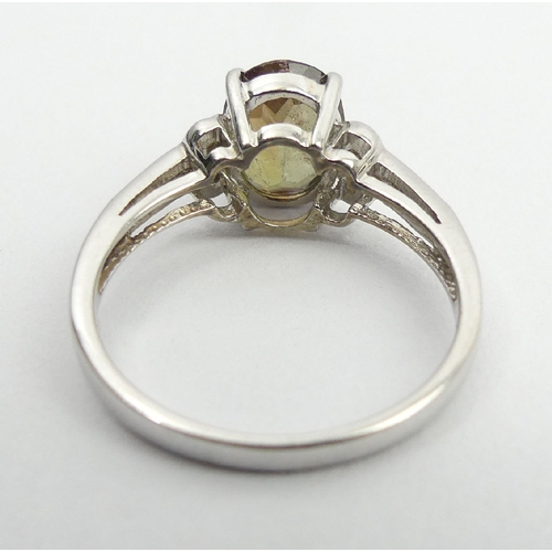 66 - 9ct white gold green citrine and diamond ring, 2.8 grams, 9mm, size N1/2. UK Postage £12.