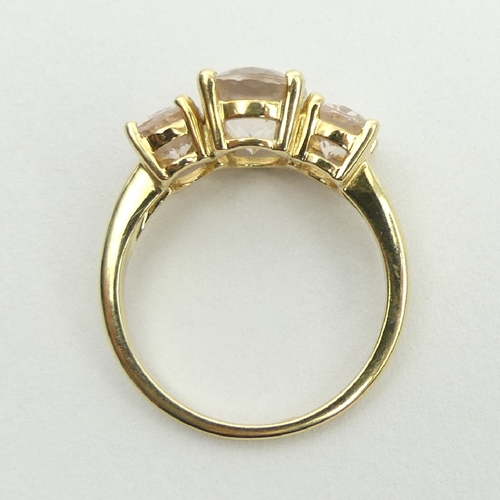 77 - 9ct gold three stone pink quartz ring, 3.1 grams, 9.1mm, size N. UK Postage £12.