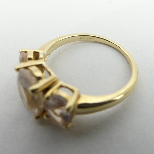 77 - 9ct gold three stone pink quartz ring, 3.1 grams, 9.1mm, size N. UK Postage £12.