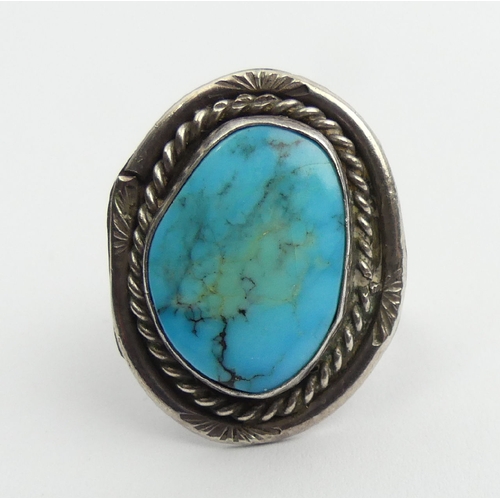 81 - Native American sterling silver and turquoise ring, 7.6 grams, 29mm, size O1/2. UK Postage £12.