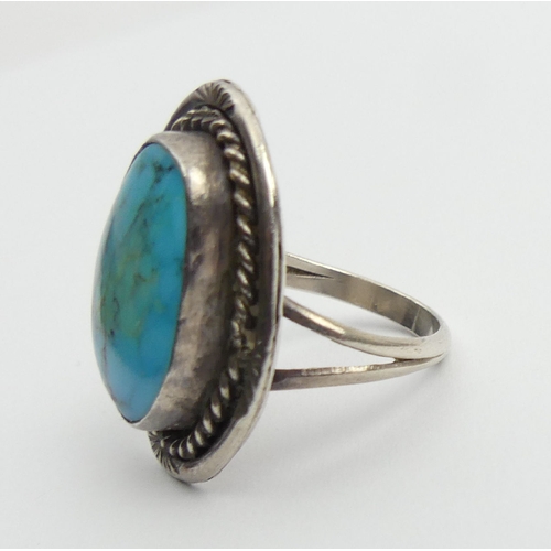 81 - Native American sterling silver and turquoise ring, 7.6 grams, 29mm, size O1/2. UK Postage £12.