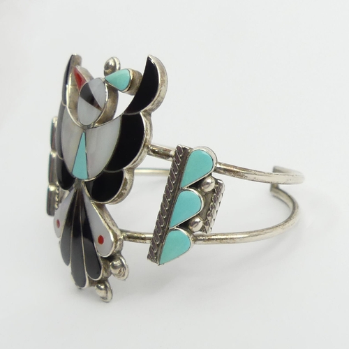 84 - Native American sterling silver multi-coloured stone set eagle cuff bangle, signed, 24.7 grams,50mm ... 