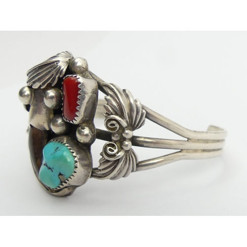 93 - Native American sterling silver turquoise, coral and claw cuff bangle, 27.7 grams, 35mm. UK Postage ... 