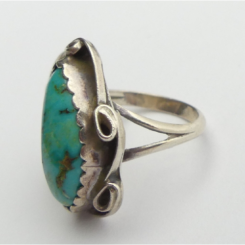 95 - Native American silver and turquoise set ring, signed R.L., 7.3 grams, 24mm, size M1/2. UK Postage £... 