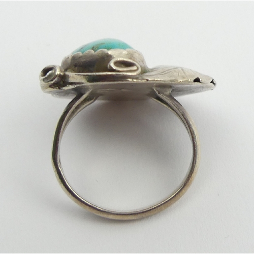 95 - Native American silver and turquoise set ring, signed R.L., 7.3 grams, 24mm, size M1/2. UK Postage £... 