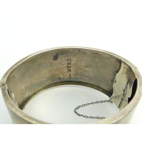 102A - Sterling silver engraved, hinged bangle, Chester 1934, 38 grams, 31mm.UK Postage £12.