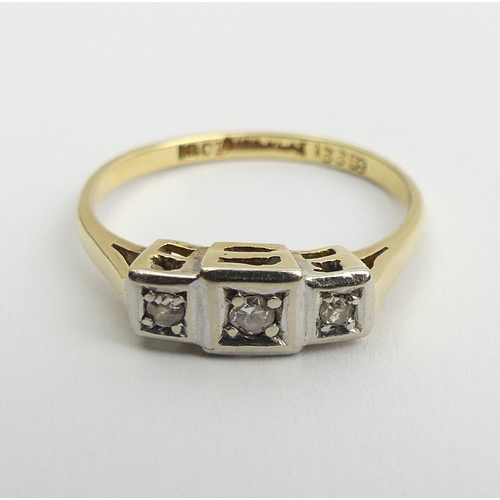 106 - 18ct gold and platinum diamond three stone ring, 2.4 grams, 4.9mm, size O. UK Postage £12.