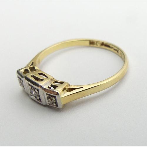 106 - 18ct gold and platinum diamond three stone ring, 2.4 grams, 4.9mm, size O. UK Postage £12.