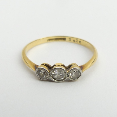 108A - 18ct gold diamond three stone ring, 1.4 grams, 3.8mm, size L. UK Postage £12.