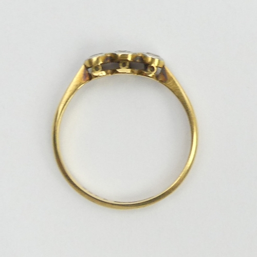 108A - 18ct gold diamond three stone ring, 1.4 grams, 3.8mm, size L. UK Postage £12.