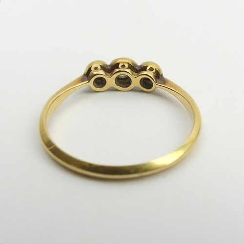 108A - 18ct gold diamond three stone ring, 1.4 grams, 3.8mm, size L. UK Postage £12.