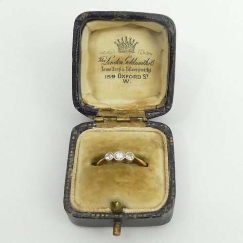 108A - 18ct gold diamond three stone ring, 1.4 grams, 3.8mm, size L. UK Postage £12.