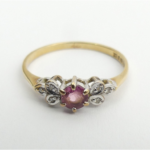 109 - 9ct gold, ruby and diamond ring, 1.2 grams, 5.1mm, size N. UK Postage £12.