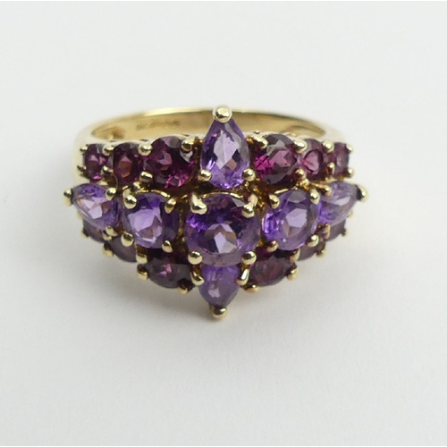 110 - 9ct gold, pink tourmaline and amethyst dress ring, 4.9 grams, 15.6mm, size P. UK Postage £12.