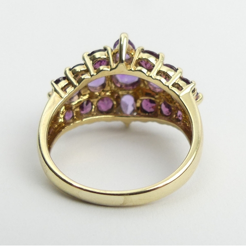 110 - 9ct gold, pink tourmaline and amethyst dress ring, 4.9 grams, 15.6mm, size P. UK Postage £12.