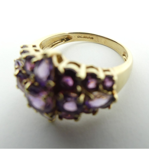 110 - 9ct gold, pink tourmaline and amethyst dress ring, 4.9 grams, 15.6mm, size P. UK Postage £12.