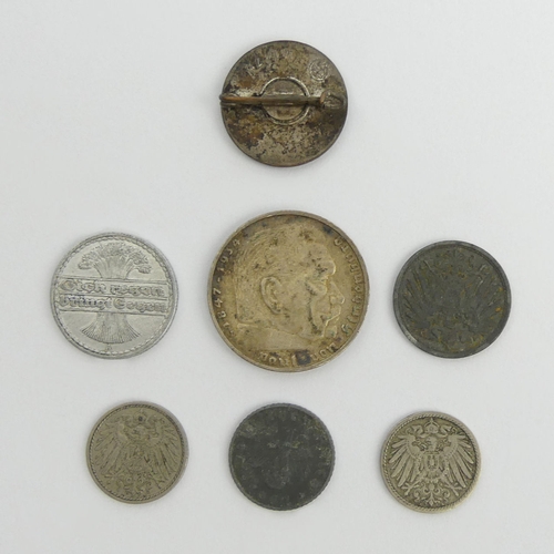 202 - Various German swastika coinage and an enamel National Socialist badge. UK Postage £12.