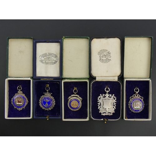 207 - Four silver and enamel boxed, local interest, fobs and a silver fob, Birm. 1897, 62.2 grams. UK Post... 